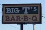 Sign reading 'Big T's Bar-B-Q' against the sky.